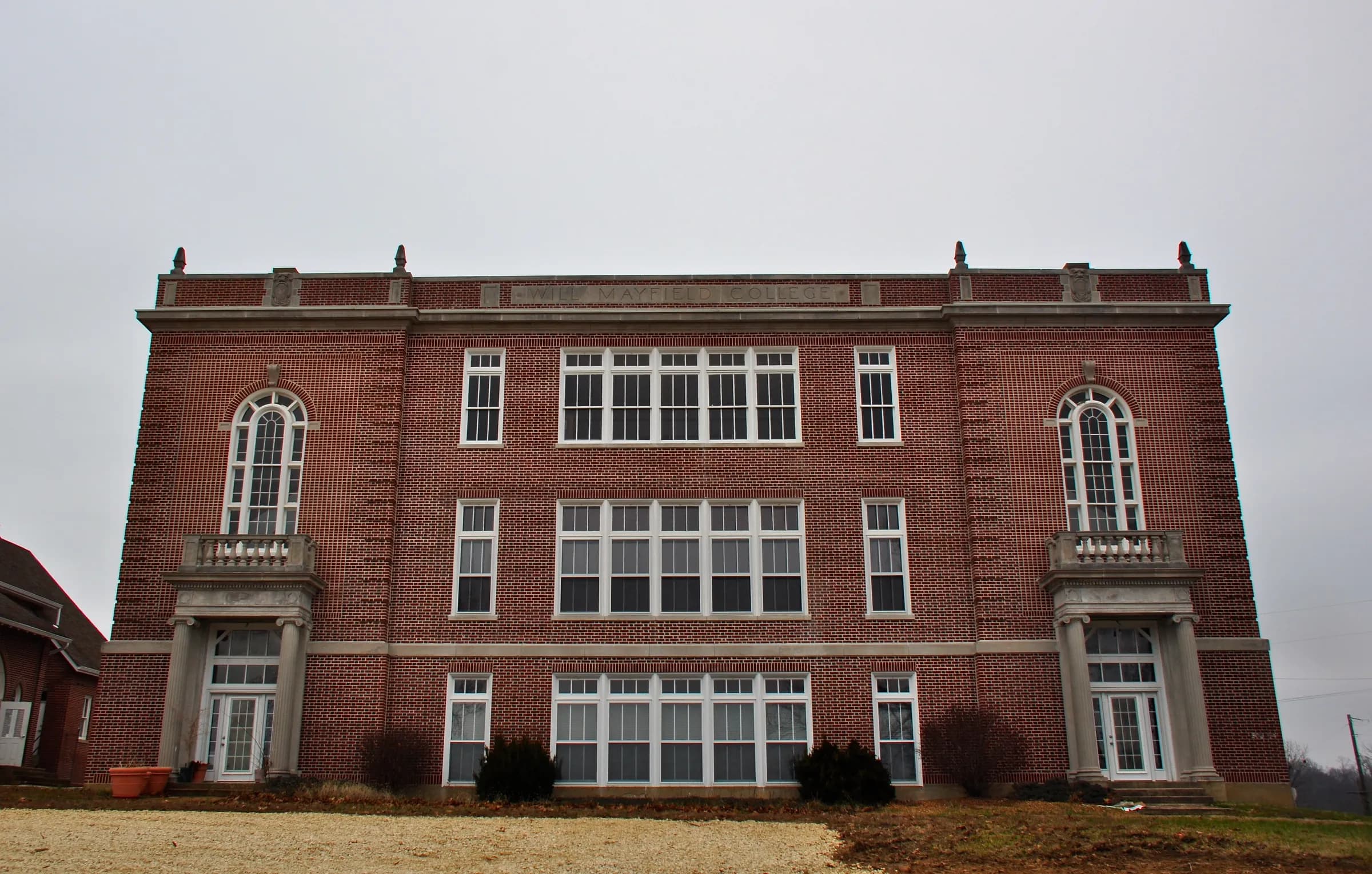 The three-story brick Arts and Science Building of Will Mayfield College in Marble Hill